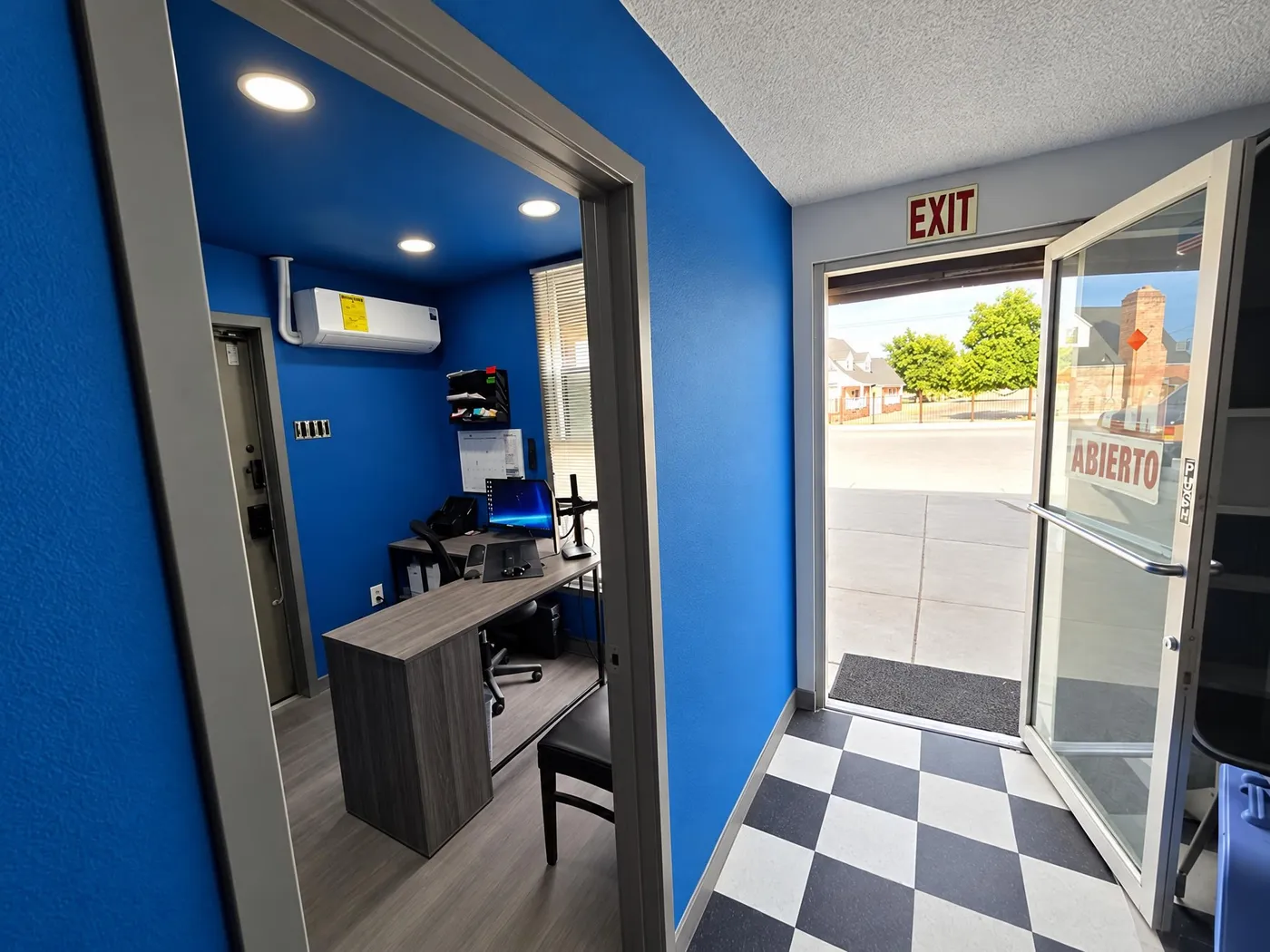 Customer waiting area with blue walls and checkerboard floor